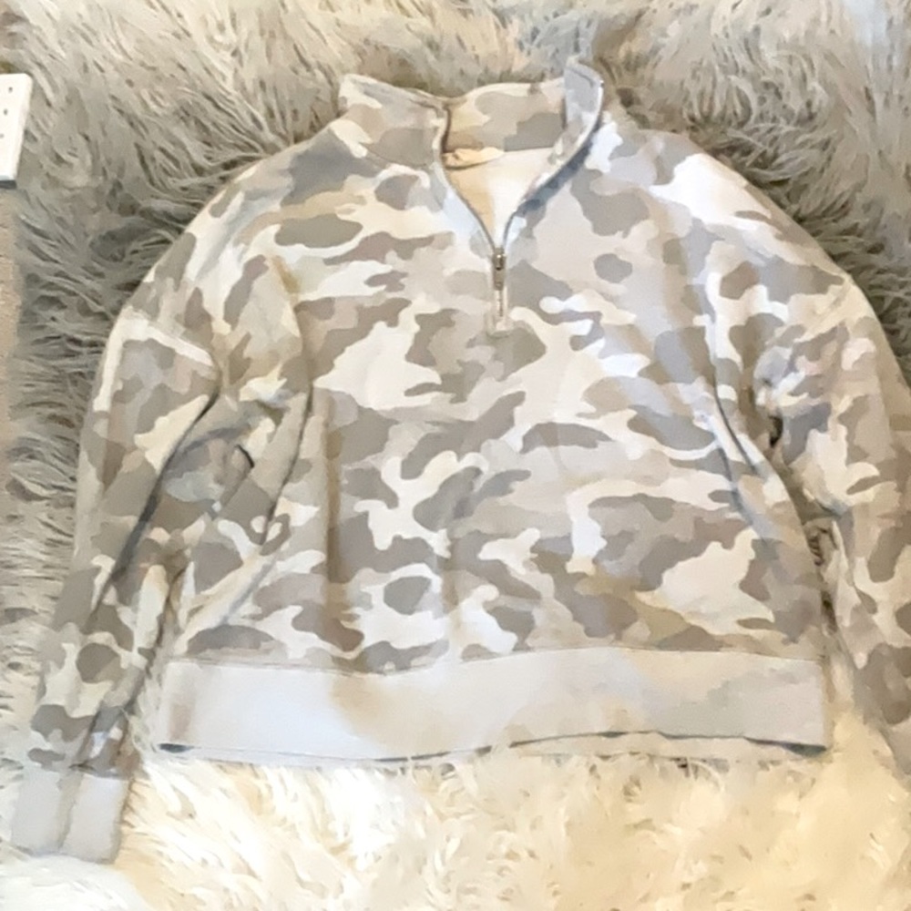 This is a cute hippie rose  camo sweater.